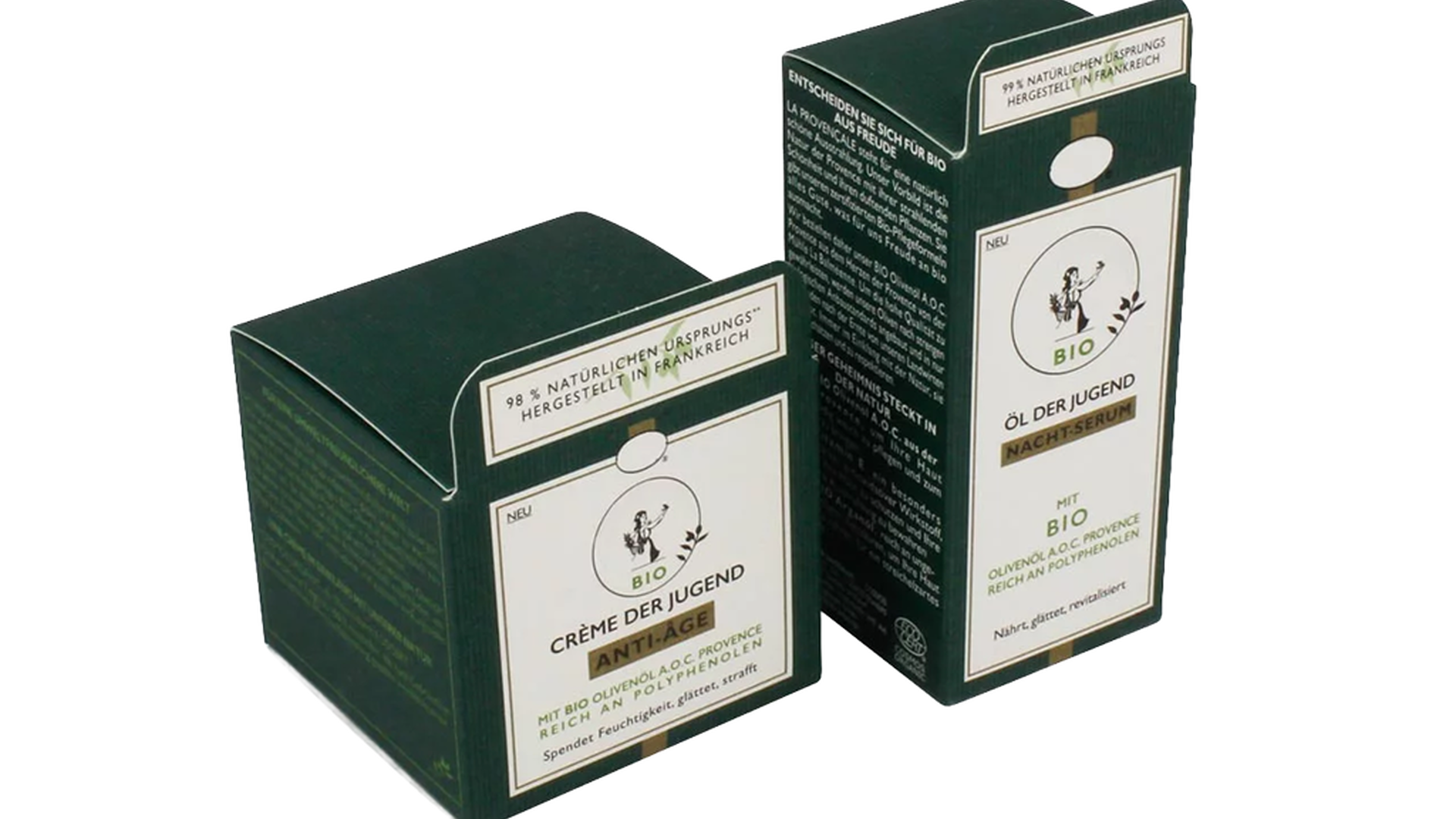 Zwei grüne Faltschachteln mit weißem Etikett für „Crème der Jugend“ und „Öl der Jugend Nacht-Serum“ aus Bio-Olivenöl.